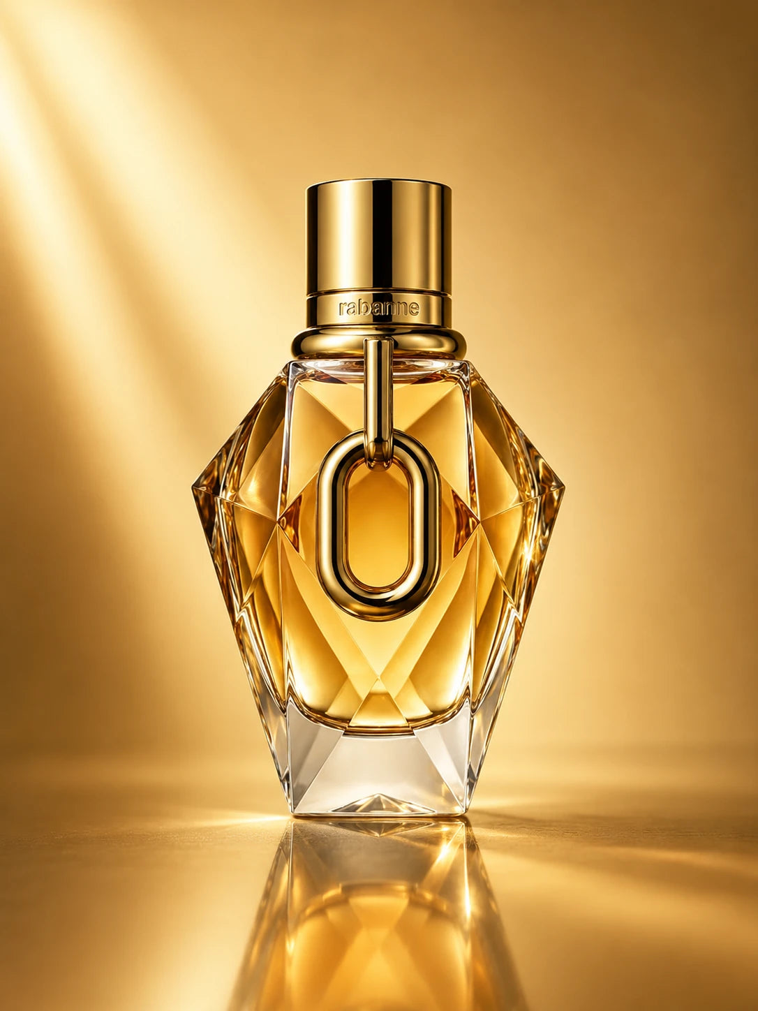 Lujoso frasco dorado facetado del perfume Million Gold For Her.