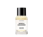 Frasco minimalista transparente con tapón negro del perfume Neroli Oranger de Matiere Premiere.